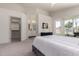 Bright main bedroom with a dressing area and a view to the bathroom at 3940 E Heather Ct, Gilbert, AZ 85234
