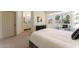 Comfortable primary bedroom featuring natural light from backyard views and neutral decor at 3940 E Heather Ct, Gilbert, AZ 85234