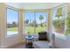 Bay window seating area showcasing an oversized, patterned chair with neighborhood views and sun-drenched backyard at 3940 E Heather Ct, Gilbert, AZ 85234