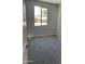 Cozy bedroom with carpet flooring, neutral walls, and a window view at 4924 W Brown St, Glendale, AZ 85302