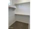 Walk-in closet with ample shelving and storage for clothing and personal items at 4924 W Brown St, Glendale, AZ 85302