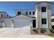 Charming two-story home featuring a three-car garage, stone facade, and well-maintained landscaping at 4924 W Brown St, Glendale, AZ 85302