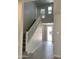 Open foyer area with a staircase, wood-look tile flooring, and plenty of natural light at 4924 W Brown St, Glendale, AZ 85302