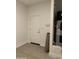 This garage space includes white walls and a utility door plus a water heater at 4924 W Brown St, Glendale, AZ 85302