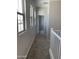 Bright hallway with large windows and neutral carpet leading to other rooms at 4924 W Brown St, Glendale, AZ 85302