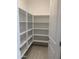 Walk-in pantry providing ample storage space with built-in shelving at 4924 W Brown St, Glendale, AZ 85302