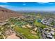 Extensive aerial view featuring a community pool, tennis courts, golf course, and luxurious hillside accommodations at 4938 N Ascent Dr, Scottsdale, AZ 85251