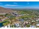 Scenic aerial view with mountain backdrop showcases a meticulously planned community with golf course and community pools at 4938 N Ascent Dr, Scottsdale, AZ 85251