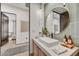 Contemporary bathroom with a round mirror, modern sink, and stylish lighting for a sleek design at 4938 N Ascent Dr, Scottsdale, AZ 85251
