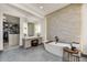 Spacious bathroom featuring a soaking tub, vanity, and a walk-in closet for ample storage at 4938 N Ascent Dr, Scottsdale, AZ 85251