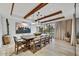 Stylish dining room with beamed ceilings, modern lighting, and a large table for elegant meals at 4938 N Ascent Dr, Scottsdale, AZ 85251