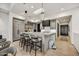 Chic kitchen features a marble island with seating, modern pendant lighting, and sleek cabinetry at 4938 N Ascent Dr, Scottsdale, AZ 85251