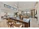 Open-concept living area showcasing modern design, a dining table, and an adjacent workspace upstairs at 4938 N Ascent Dr, Scottsdale, AZ 85251
