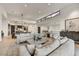 Open-concept living room featuring hardwood floors and ample seating areas for entertaining at 4938 N Ascent Dr, Scottsdale, AZ 85251