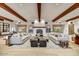 Stylish living room features beamed ceilings, a cozy fireplace, and comfortable seating at 4938 N Ascent Dr, Scottsdale, AZ 85251