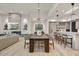 Bright open-concept living room with modern decor seamlessly transitions into the dining area and kitchen at 4938 N Ascent Dr, Scottsdale, AZ 85251