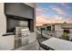 Outdoor kitchen with stainless steel grill and adjacent dining space, perfect for entertaining at 4938 N Ascent Dr, Scottsdale, AZ 85251