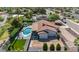 Aerial shot showcases the backyard with pool, lush landscaping, and outdoor entertaining spaces at 5101 E Paradise Dr, Scottsdale, AZ 85254