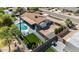 Bird's-eye view of the home featuring a pool, modern patio, and well-manicured backyard at 5101 E Paradise Dr, Scottsdale, AZ 85254