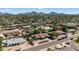 Serene neighborhood aerial with mountain views, mature trees, and well-maintained landscaping at 5101 E Paradise Dr, Scottsdale, AZ 85254