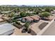 Breathtaking aerial view of the property featuring a pool, patio, and beautifully landscaped yard at 5101 E Paradise Dr, Scottsdale, AZ 85254