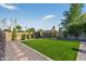 Well-manicured backyard with artificial turf and attractive landscaping at 5101 E Paradise Dr, Scottsdale, AZ 85254
