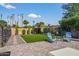 Relax in the serene backyard featuring lush landscaping, a patio, and comfortable seating at 5101 E Paradise Dr, Scottsdale, AZ 85254