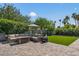 Backyard with outdoor seating area featuring comfortable sectional, coffee table, and umbrella at 5101 E Paradise Dr, Scottsdale, AZ 85254