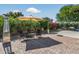 Spacious outdoor living area with patio, lounge chairs, BBQ and mature landscaping at 5101 E Paradise Dr, Scottsdale, AZ 85254