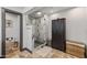 This bathroom features a glass enclosed shower, gray floor-to-ceiling cabinet and neutral color scheme at 5101 E Paradise Dr, Scottsdale, AZ 85254