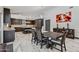 Open dining area next to the kitchen with plenty of seating and natural light creating a welcoming space at 5101 E Paradise Dr, Scottsdale, AZ 85254
