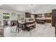 Inviting dining area with stylish table, natural light, and seamless flow to the modern kitchen at 5101 E Paradise Dr, Scottsdale, AZ 85254