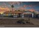 Beautiful home featuring desert landscaping, a two-car garage, and a covered porch, perfect for relaxed living at 5101 E Paradise Dr, Scottsdale, AZ 85254