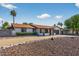 Charming one-story home featuring low maintenance desert landscaping and a two-car garage at 5101 E Paradise Dr, Scottsdale, AZ 85254