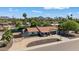 Charming home with a well-maintained yard and inviting curb appeal in a picturesque neighborhood at 5101 E Paradise Dr, Scottsdale, AZ 85254