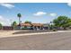 Single-story home featuring desert landscaping, a two-car garage, and privacy fence for a secluded outdoor space at 5101 E Paradise Dr, Scottsdale, AZ 85254