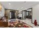 Grand foyer featuring marble floors, decorative rug, light grey accent brick, and an open floor plan at 5101 E Paradise Dr, Scottsdale, AZ 85254