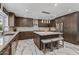 Spacious kitchen with center island, breakfast bar, stainless appliances and modern lighting making it an ideal cooking space at 5101 E Paradise Dr, Scottsdale, AZ 85254