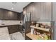 Well-equipped kitchen with custom cabinetry, stainless steel appliances, and granite countertops, and convenient pantry pull-outs at 5101 E Paradise Dr, Scottsdale, AZ 85254