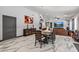 Open dining and living area with marble floors, a dining table and a large sectional for Gathering and guests at 5101 E Paradise Dr, Scottsdale, AZ 85254