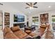 Relaxing living room with comfortable seating, media center, and open access to the outdoor pool area at 5101 E Paradise Dr, Scottsdale, AZ 85254