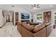Comfortable living room featuring stylish decor, media center, and open access to the outdoor pool area at 5101 E Paradise Dr, Scottsdale, AZ 85254