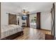 Main bedroom featuring wood-look floors, rustic barn door, ceiling fan, and doors to the pool area at 5101 E Paradise Dr, Scottsdale, AZ 85254