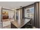 Home office featuring hard surface floors, grey brick accents, built-in lighting and storage, and an open floorplan at 5101 E Paradise Dr, Scottsdale, AZ 85254