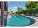 Relaxing backyard pool with rock feature, lush landscaping, and plenty of room for lounging at 5101 E Paradise Dr, Scottsdale, AZ 85254