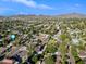 Aerial shot of neighborhood with mountain views showcasing lush green landscaping and beautiful blue skies at 538 W Las Palmaritas Dr, Phoenix, AZ 85021