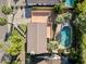 Aerial view of the home showcasing its landscaping, roof, upper deck, and pool at 538 W Las Palmaritas Dr, Phoenix, AZ 85021