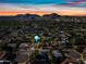 Sunset aerial view of neighborhood featuring mountain views and colorful skies at 538 W Las Palmaritas Dr, Phoenix, AZ 85021