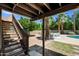 Backyard showing stairs to upper deck, large patio, pool, and an outdoor seating area at 538 W Las Palmaritas Dr, Phoenix, AZ 85021