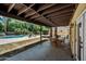 Spacious backyard featuring a covered patio, dining area, pool, and serene landscaping at 538 W Las Palmaritas Dr, Phoenix, AZ 85021